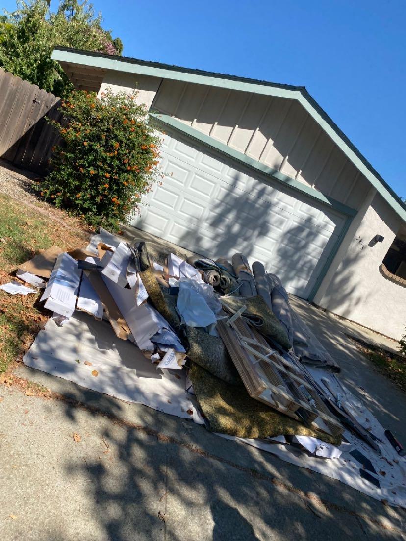 Furniture, boxes, and household items ready for hauling